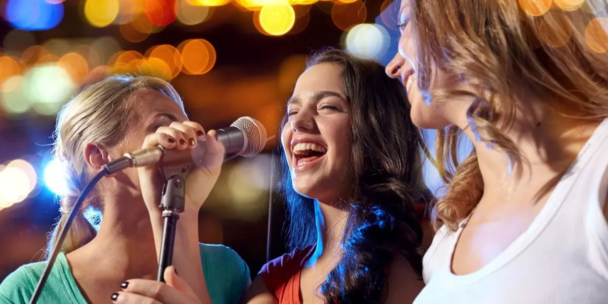 3 Woman singing karoake